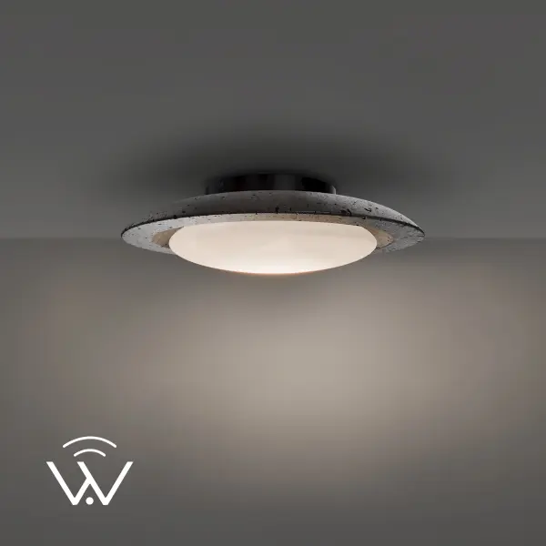 The Saturno brings cosmic-inspired design to earth with its unique fusion of basalt stone, travertine, and opal glass. This 20" flush mount delivers warm, even illumination with tunable white capability (1800K-4000K via WAC Home system).