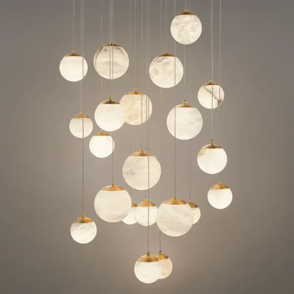 The Pisces multilight pendant creates a dramatic focal point with 21 natural Spanish alabaster orbs suspended at varying heights. Its high-output LED system delivers exceptional illumination while the aged brass finish adds warmth and sophistication to contemporary spaces. - alternate view