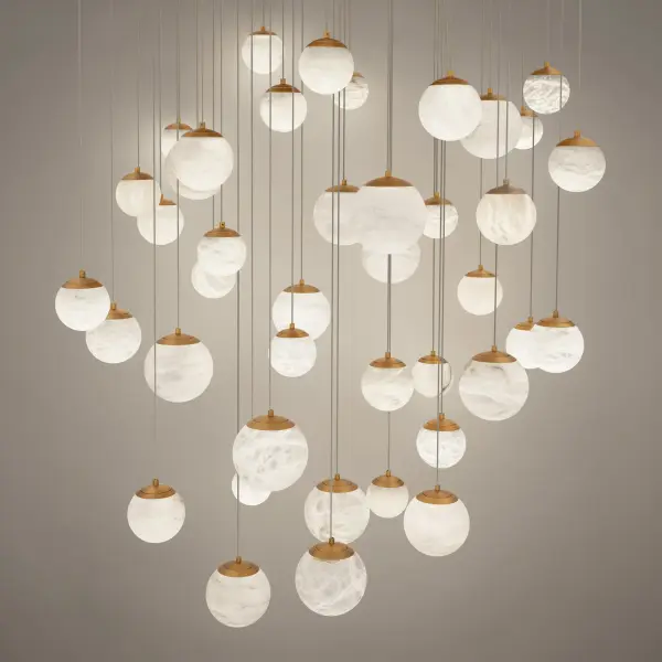The Pisces transforms any space into an art gallery with its constellation of 41 natural Spanish alabaster spheres suspended at varying heights. This architectural masterpiece delivers exceptional illumination while creating dramatic visual impact. - alternate view