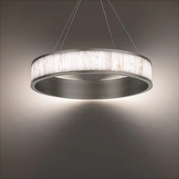 The Coliseo chandelier combines natural Spanish alabaster tiles with luminous antique nickel metalwork, creating sophisticated ambient lighting. Its 28-inch profile and integrated LED technology deliver energy-efficient illumination with exceptional color rendering.