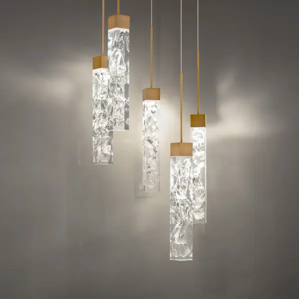 The Minx multilight pendant combines artisanal K5 crystal with aged brass for a glamorous yet contemporary look. Five integrated LED modules deliver bright, efficient lighting while creating visual drama in any space.