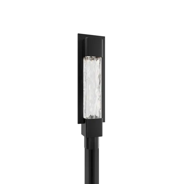 The Mist outdoor post light combines handcrafted seeded glass with modern LED technology. Its weather-resistant aluminum frame and 3000K warm illumination create inviting ambiance for entryways and pathways.