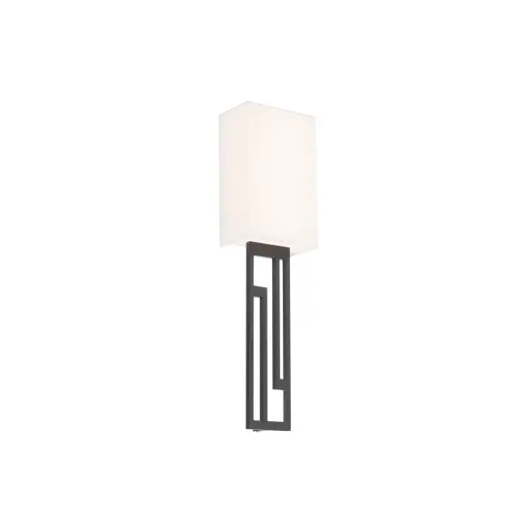 The Vander wall sconce combines minimalist design with functional elegance. Its 22-inch profile features a die-cast aluminum frame with a woven fabric shade that softly diffuses warm 2700K LED light, perfect for creating ambient lighting.