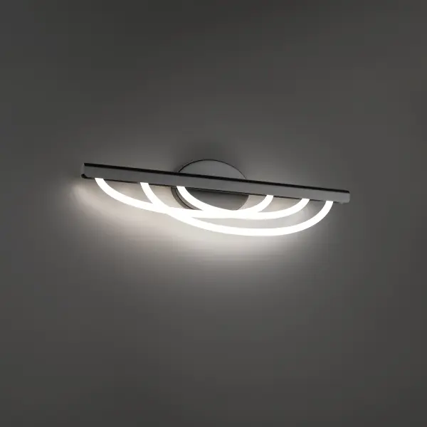 The Swoop vanity light transforms bathroom lighting with its distinctive looped silica tubing design. Suspended from a sleek aluminum bar, the soft swags create an ethereal, continuous glow perfect for modern bathrooms.