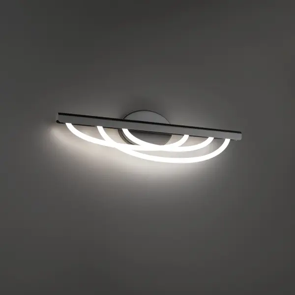 The Swoop vanity light transforms bathroom lighting with its distinctive looped silica tubes that create an otherworldly ambient glow. At 34 inches wide, it provides excellent illumination for larger vanities while serving as a striking design statement.