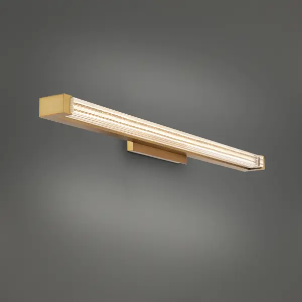 The Skein vanity light combines sparkling K5 crystal with integrated LED technology to create intricate light patterns. Its 33-inch elongated design and aged brass finish bring Hollywood glamour to modern bathrooms.