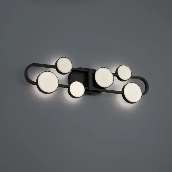 The Tableau Bath Vanity Light combines Art Deco-inspired geometric design with modern LED technology. Its interlocking ovals and rings create a sophisticated focal point, while hidden LEDs illuminate meticulously cut art glass shades for ambient lighting.