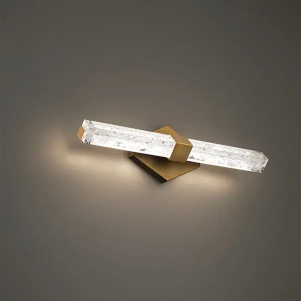 The Regal vanity light combines mid-century elegance with modern LED efficiency. Reclaimed crystal shards create dramatic ambient illumination, while the aged brass finish adds warmth. Versatile installation in horizontal or vertical orientation.