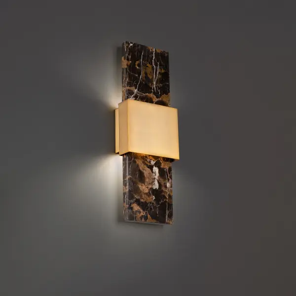 The Mercer Wall Sconce delivers sophisticated drama with exquisite black and gold marble banded by gleaming aged brass. This 24" statement piece combines high-end materials with energy-efficient LED technology for lasting brilliance.