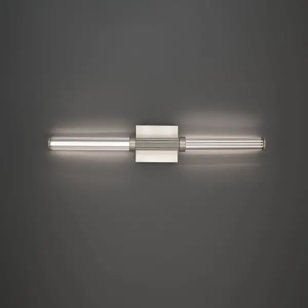 The Ribeye vanity light combines textured ribbed glass with a grooved column design for sophisticated bathroom lighting. Integrated 3000K LED filaments provide warm, high-CRI illumination perfect for grooming tasks.