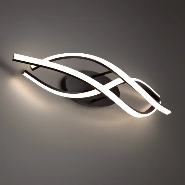 The Lior vanity light delivers refined modern elegance with its gracefully curved illuminated lines. High-output LED technology provides bright, even lighting perfect for grooming tasks while the sleek black finish complements contemporary bathrooms.