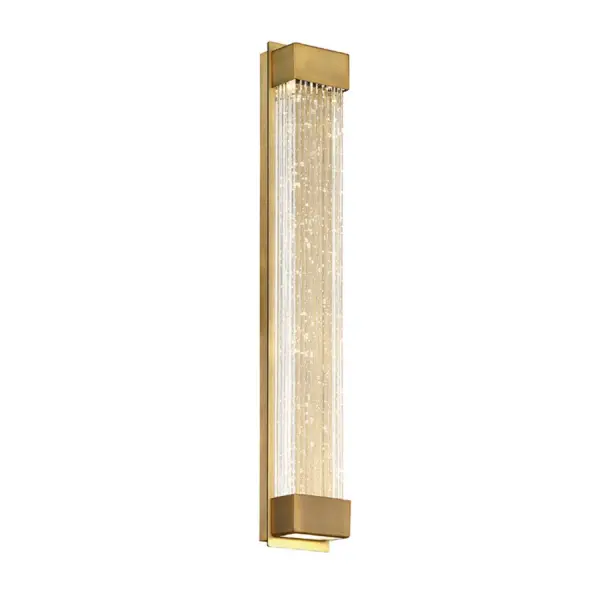 The Tower sconce combines trending aged brass with V-cut seeded crystal for understated luxury. Dual LED modules illuminate the crystal from both ends while a hidden up/downlight provides quality indirect illumination.