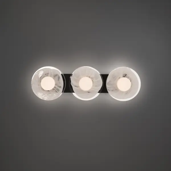The Fresco vanity light transforms bathroom lighting into art with three handcrafted wispy glass plates suspended from a sleek linear bar. Warm 3000K LED illumination highlights the unique textures in each artisanal glass piece, creating a sophisticated, spa-like atmosphere. High CRI of 90 ensures accurate color rendering for grooming tasks.