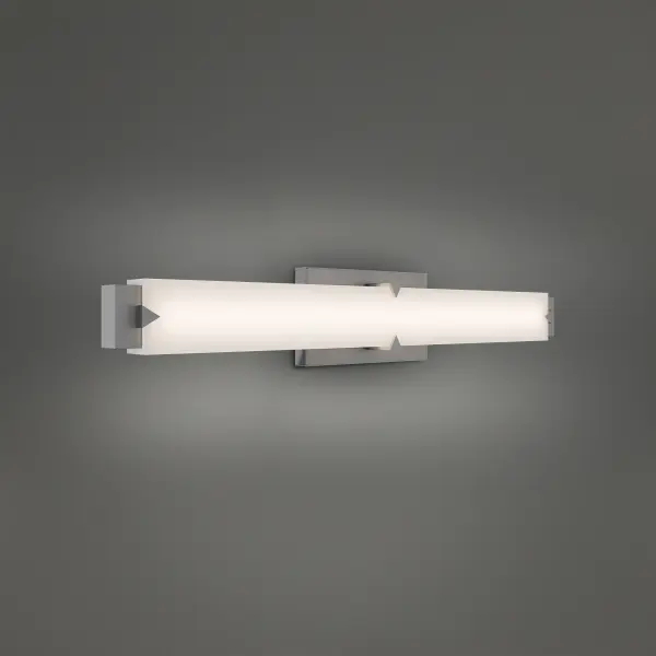 The Carlisle vanity light combines striking modern geometry with practical functionality. Its rectilinear frame and triangular accents create visual interest while the integrated LED bar delivers exceptional brightness and color accuracy.