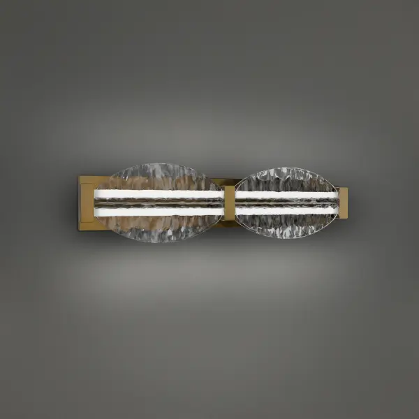 The Deco vanity light combines textural Piastri glass with jewelry-inspired metal bands for a sophisticated bathroom lighting solution. Hidden LEDs with adjustable color temperature provide versatile illumination.