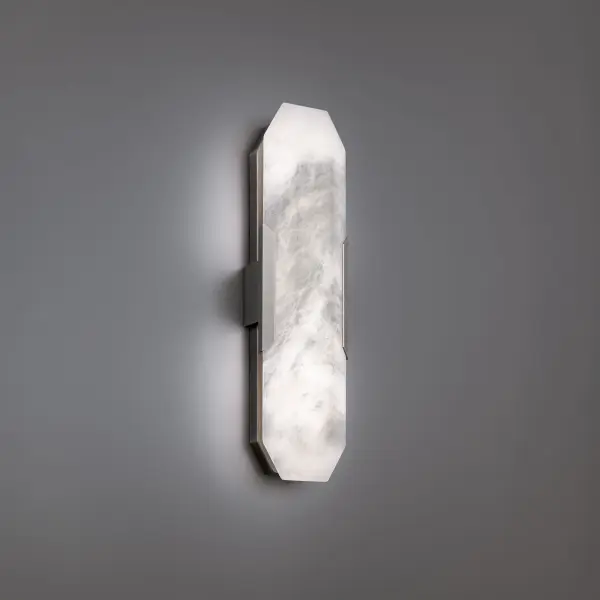 The Toulouse wall sconce elevates any space with carved alabaster held by aged brass accents. Integrated 3000K LED creates a warm, diffused glow through natural stone for an elegant, refined aesthetic perfect for luxury interiors.
