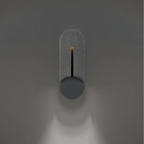 The Clog outdoor wall sconce combines natural stone elegance with modern LED technology. Its carved stone panel creates a dramatic light line while casting warm downlight, perfect for contemporary outdoor spaces.