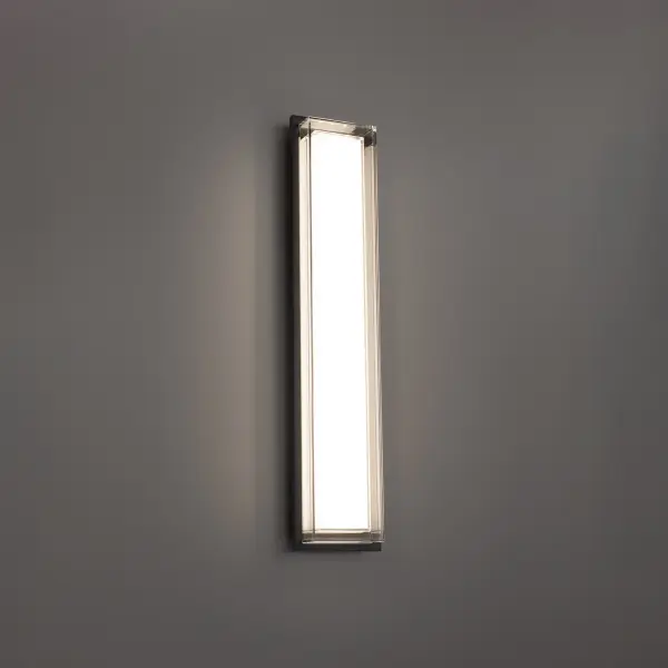 The Ice Bar outdoor wall sconce combines contemporary design with practical functionality. Its substantial backplate and etched glass shade create soft, glowing illumination perfect for modern exteriors.