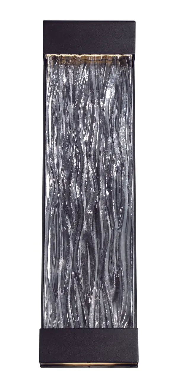 The Fathom wall sconce features striking art cast glass embraced by bold black aluminum hardware. With dual LED illumination from above and below, it creates luxurious ambiance for both exterior and interior spaces.