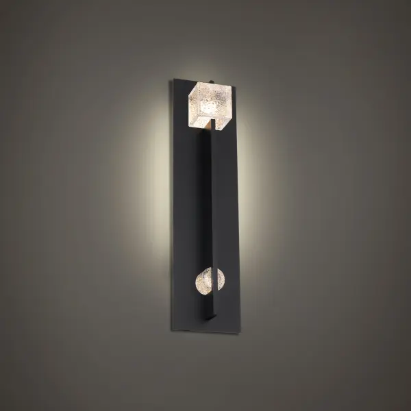 The Scepter outdoor wall sconce combines contemporary design with functional LED lighting. Its distinctive geometric glass elements create visual interest while delivering warm 3000K illumination perfect for outdoor entertaining spaces.