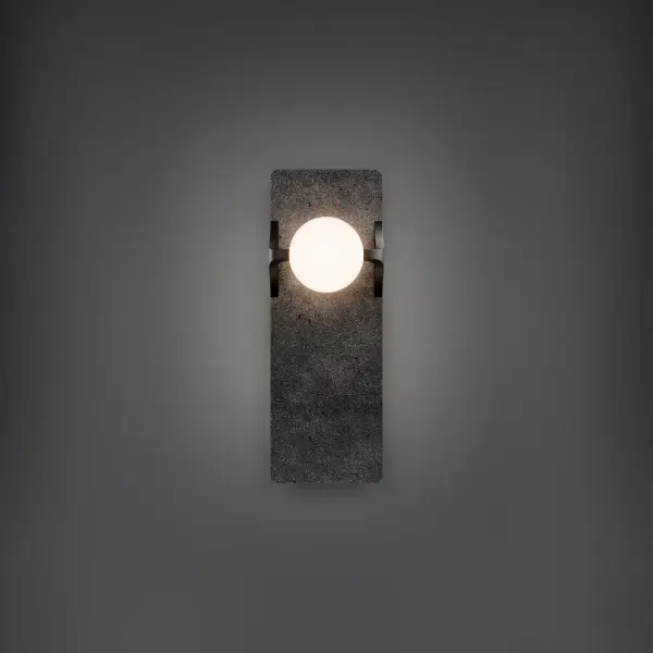 The Okemo Wall Sconce combines natural basalt stone with etched opal glass for a sophisticated, textural lighting statement. Its vertical form and warm LED glow make it ideal for modern bathrooms, hallways, and accent walls.