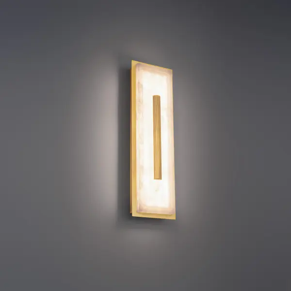 The Clarice Wall Sconce transforms natural Spanish alabaster into luminous art. Its carved stone-inspired design creates dramatic light and shadow interplay while delivering energy-efficient LED illumination with exceptional color rendering. - alternate view