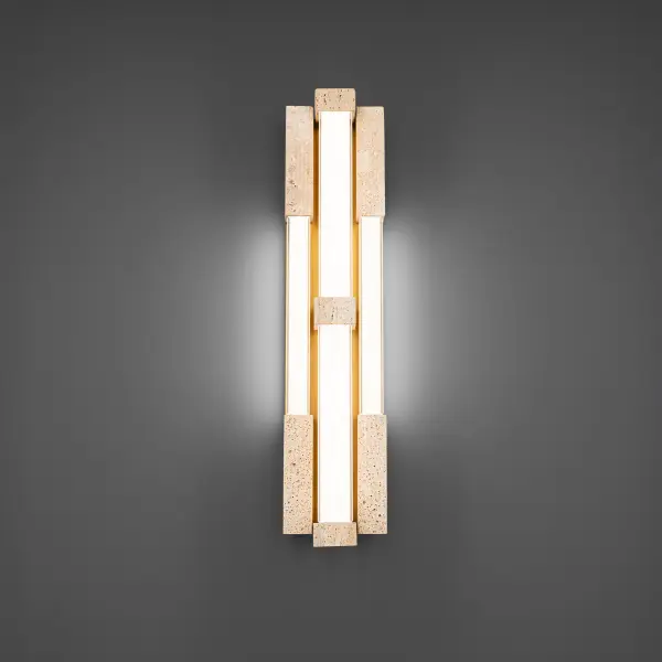 The Conan Wall Sconce delivers sophisticated modern design through its unique combination of natural travertine stone and aged brass metalwork. At 28 inches tall, it creates dramatic vertical presence with soft ambient lighting.