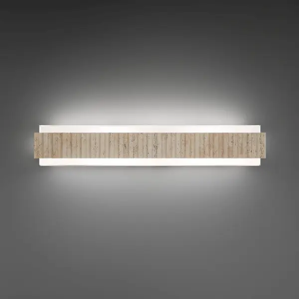 The Magnate vanity light combines natural travertine stone with aged brass and mitered glass for a sophisticated, museum-quality aesthetic. Its 27-inch linear form delivers exceptional LED illumination while making a bold design statement in modern bathrooms.