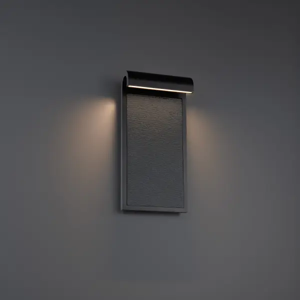 The Takonic wall sconce combines substantial granite stone panels with modern LED technology, creating dramatic light and shadow effects. Its architectural presence and cultured aesthetic make it ideal for contemporary exteriors.