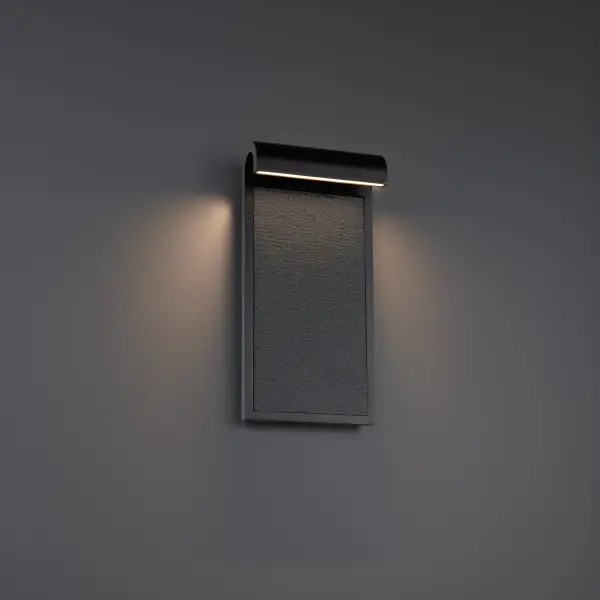 The Takonic wall sconce combines substantial granite stone panels with modern LED technology, creating dramatic light and shadow effects. Its architectural presence and cultured aesthetic make it ideal for contemporary exteriors.