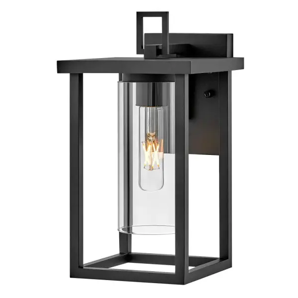 The Mateo wall lantern delivers timeless curb appeal with its blend of rectangular structure and cylindrical clear glass. Perfect for adding dimension and visual interest to outdoor spaces with a transitional aesthetic.