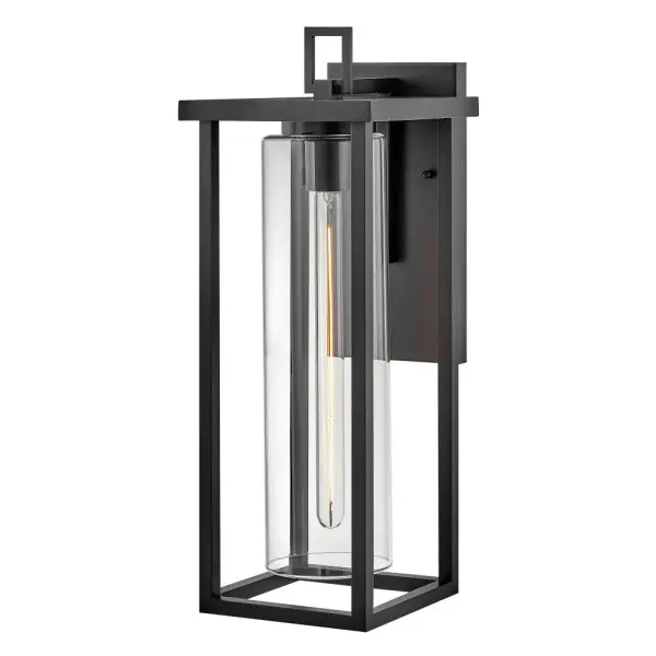 The Mateo wall lantern combines clean lines with cylindrical clear glass to create a sophisticated outdoor lighting solution. Its strong rectangular structure and black finish deliver timeless style with contemporary flair.