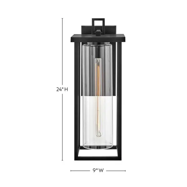 The Mateo wall lantern combines clean lines with cylindrical clear glass to create a sophisticated outdoor lighting solution. Its strong rectangular structure and black finish deliver timeless style with contemporary flair. - alternate view