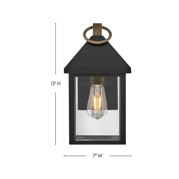 The Rhett Small Wall Lantern combines classic lantern design with modern sensibility. Tall glass panes under a distinctive pyramid roof create architectural interest, while the Black and Burnished Bronze finish adds sophisticated contrast. - alternate view