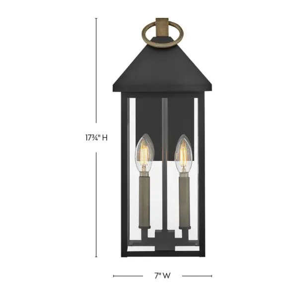 The Rhett wall lantern combines classic lantern design with modern sensibility. Its pyramid roof and tall glass panes create a sophisticated silhouette, while the Black and Burnished Bronze finish adds depth and character. - alternate view