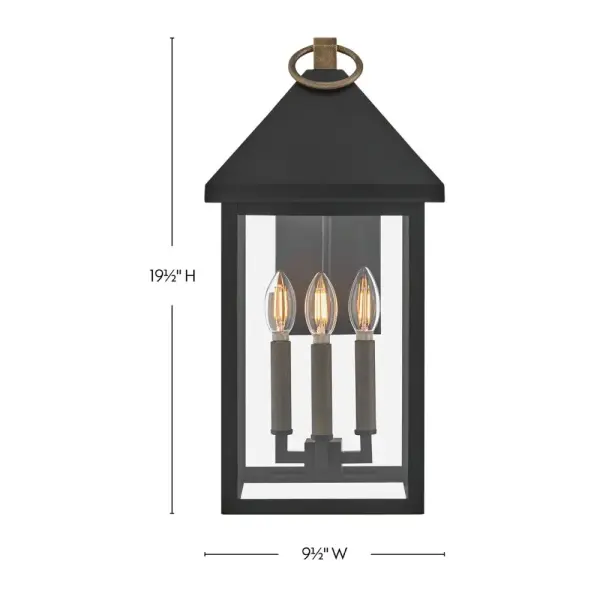 The Rhett wall lantern combines classic lantern styling with modern transitional appeal. Tall glass panes under an oversized pyramid roof create architectural interest, while the Black and Burnished Bronze finish adds sophisticated contrast. - alternate view