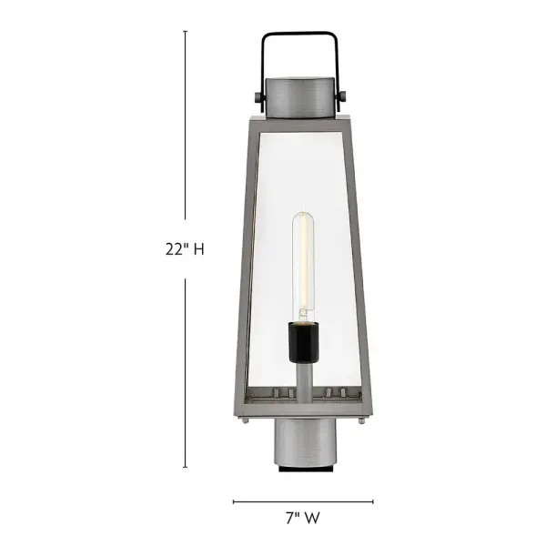 The Hugh post mount lantern delivers sleek transitional design with oversized clear glass panes and sophisticated two-tone metal finishes. Its trapezoidal silhouette adds architectural interest to porches, patios, and entryways. - alternate view