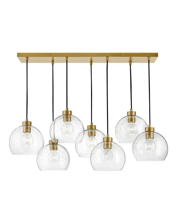 The Rumi brings modern sophistication with seven clear seedy glass globes suspended in a linear arrangement. The Lacquered Brass finish adds warmth while the art-forward design creates visual interest in both airy and intimate spaces.