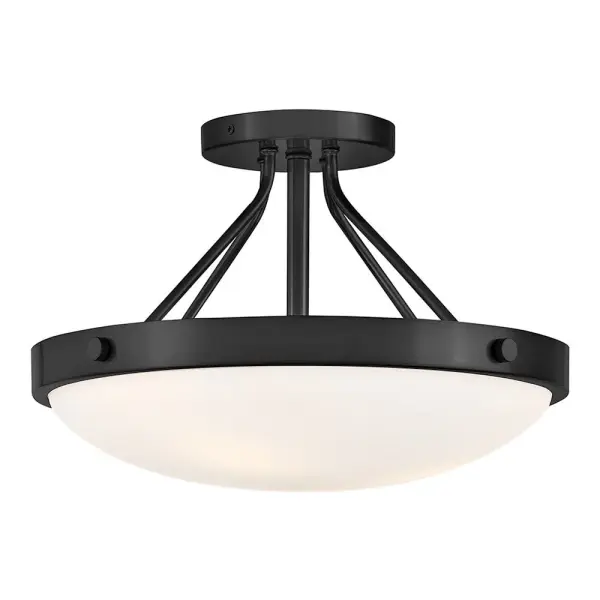 The Gus semi-flush mount combines contemporary design with versatile black finish, perfect for spaces with lower ceilings. Its compact 14.5-inch profile delivers modern style without overwhelming smaller rooms.