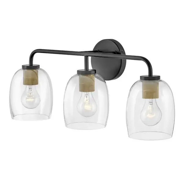 The Percy vanity light combines transitional style with industrial detailing through distinctive bell-shaped glass shades and a striking black finish with brass accents. Its versatile up-or-down installation makes it adaptable to any bathroom layout. - alternate view