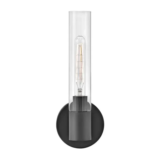 The Shea vanity light combines minimalist elegance with practical functionality. Its elongated cylindrical glass shade and versatile black finish make it adaptable to various design schemes while providing focused task lighting. - alternate view