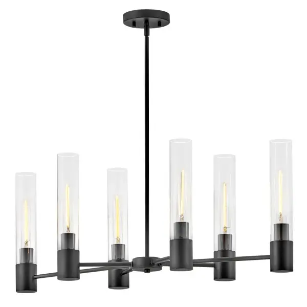 The Shea Linear Chandelier combines clean cylindrical glass shades with a sophisticated black finish, creating a multipurpose fixture that adapts to various design aesthetics from modern to transitional spaces.