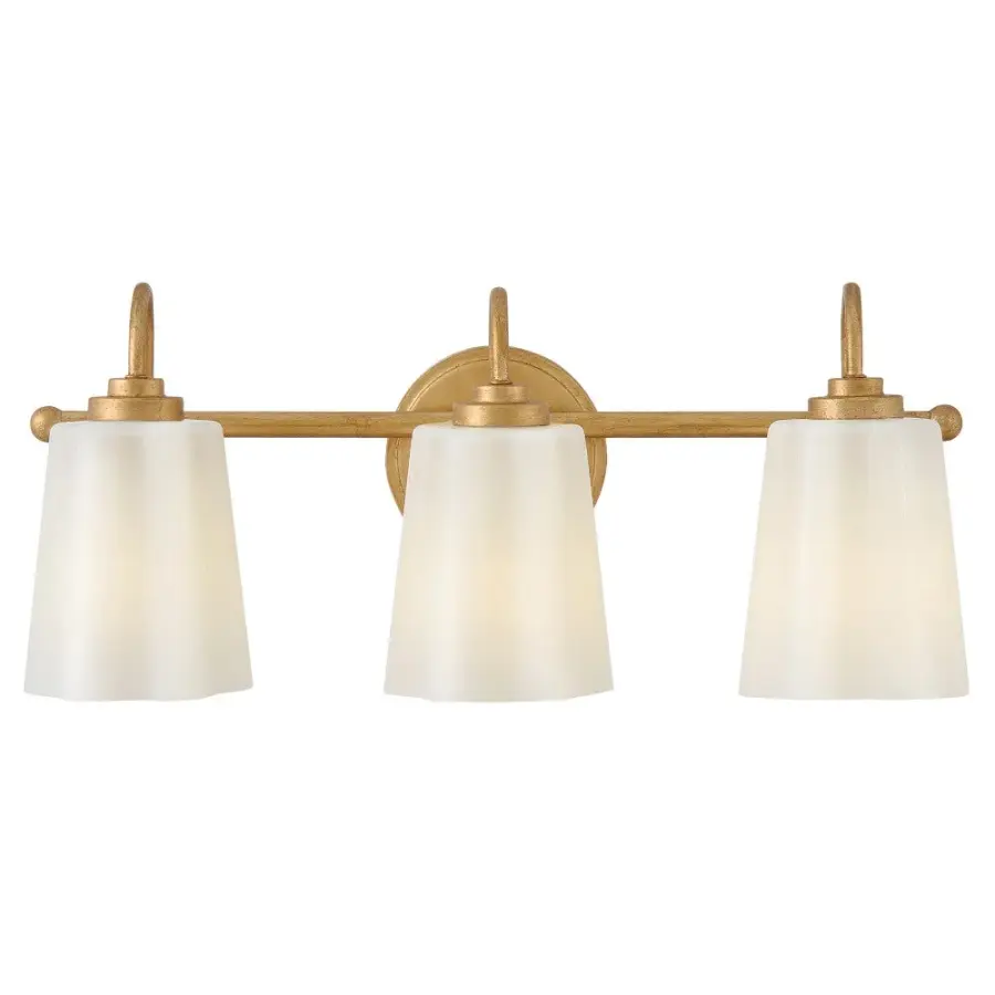 Honey Medium Three Light Vanity in Distressed Brass - Image 1