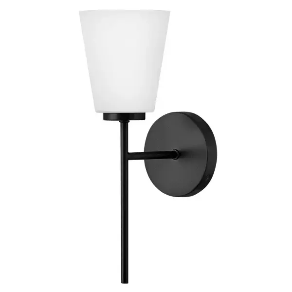 The Bri vanity light combines transitional styling with practical functionality. Its tapered etched opal glass shade provides soft, flattering illumination perfect for bathroom tasks. The clean black finish complements modern and traditional décor alike. - alternate view
