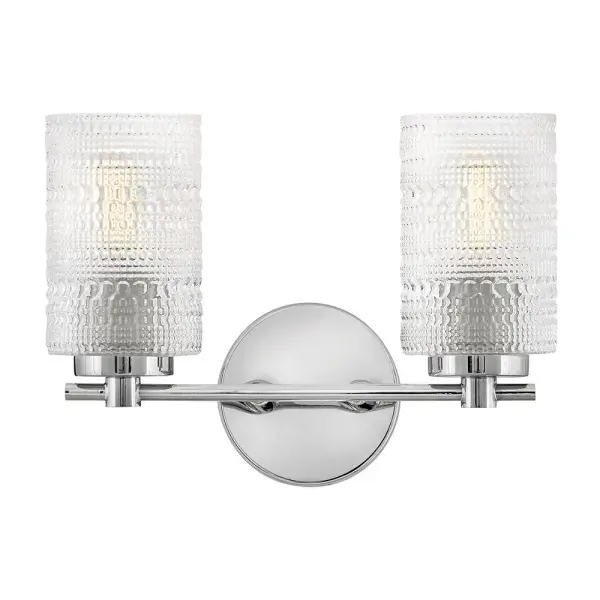 The Mabel vanity light brings eclectic vintage style with its distinctive hobnail glass shades and polished chrome finish. Perfect for smaller bathrooms or powder rooms, this two-light fixture delivers both character and functionality.