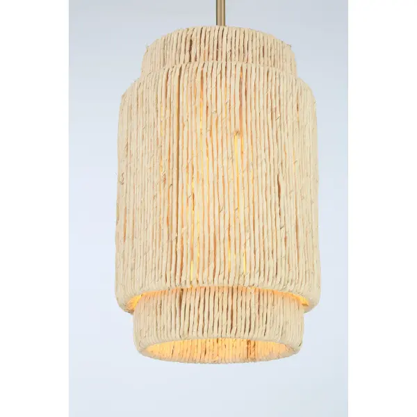 The Caviana pendant brings organic warmth with its handwoven natural abaca shade and signature brass finish. Perfect for adding coastal charm to intimate spaces, this compact fixture delivers character without overwhelming smaller rooms. - alternate view