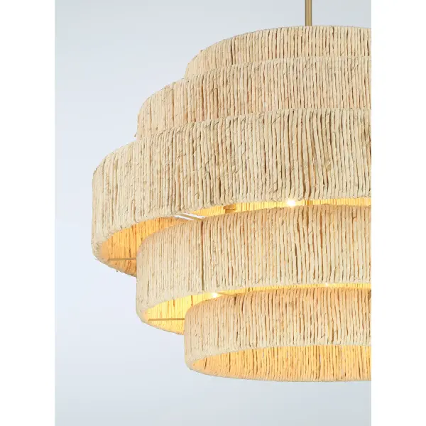 The Caviana pendant blends natural abaca woven texture with signature brass metalwork, creating a statement piece that brings warmth and organic beauty to any space. Its generous 31-inch width makes it perfect for dining areas and kitchen islands. - alternate view