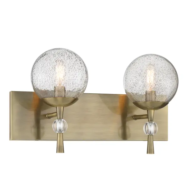 The Populuxe 2-Light Bath Lamp combines oxidized aged brass with distinctive volcanic glass shades for a sophisticated modern aesthetic. Perfect for contemporary bathrooms seeking statement lighting with artisanal character. - alternate view