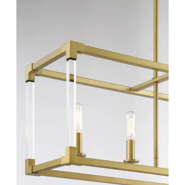 The Oro District brings contemporary elegance to kitchen islands and dining spaces with its clean linear design and warm soft brass finish. Five candelabra lights paired with clear acrylic accents create a sophisticated glow. - alternate view