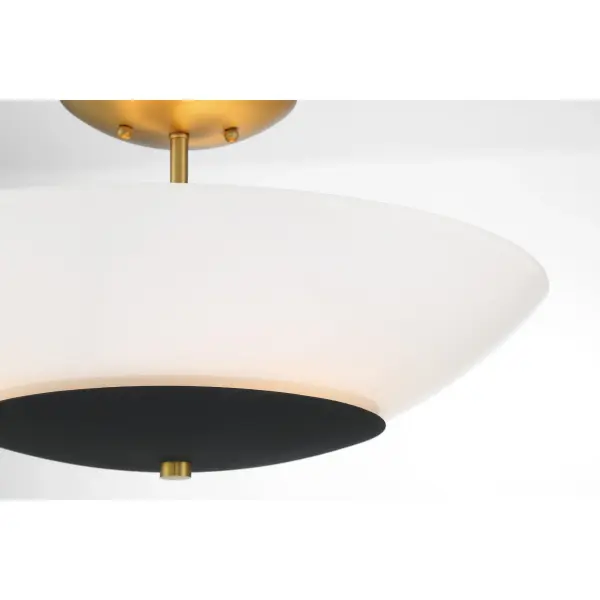 The Bax semi-flush mount combines contemporary styling with practical functionality. Its sand coal and soft brass finish adds warmth, while frosted opal glass provides soft, even illumination perfect for smaller spaces. - alternate view